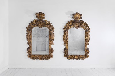 Lot 121 - A pair of George II giltwood pier mirrors attributed to Matthias Lock