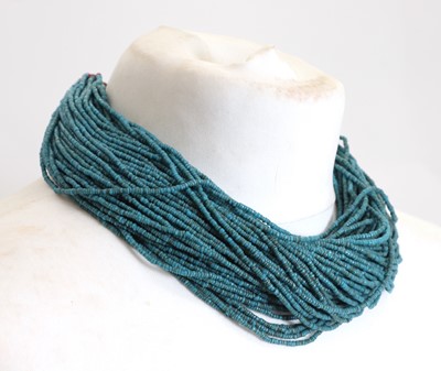 Lot 427 - A Naga blue glass multi-strand beaded necklace