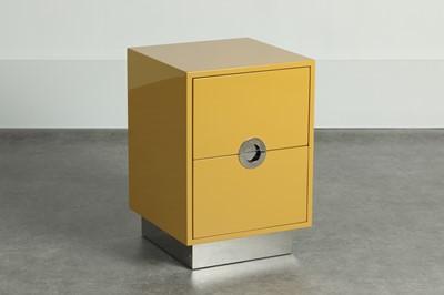Lot 44 - A mustard lacquered and chrome side cabinet