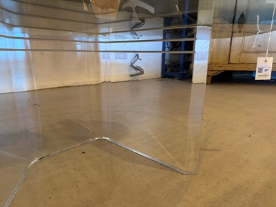 Lot 227 - A Lucite and glass coffee table