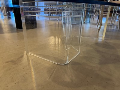 Lot 227 - A Lucite and glass coffee table