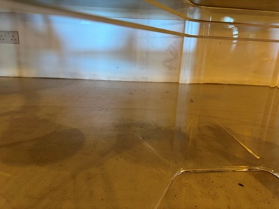 Lot 227 - A Lucite and glass coffee table