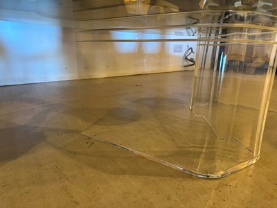 Lot 227 - A Lucite and glass coffee table
