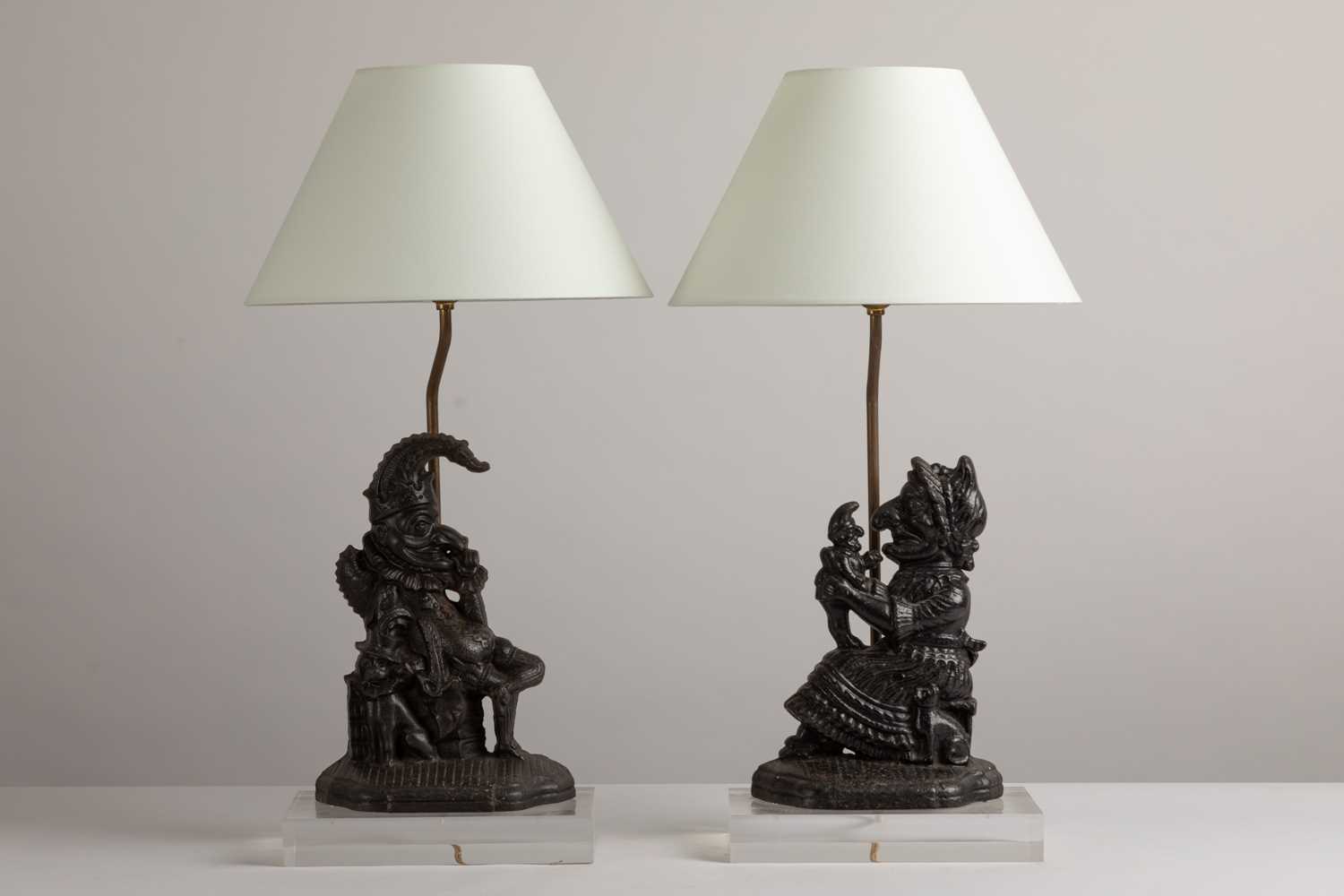 Lot 222 - A pair of 'Punch and Judy' door porter table lamps