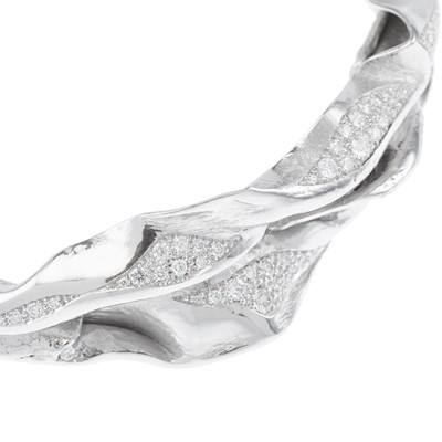 Lot 255 - Ken Bolan and Marinette Domon: a white gold diamond 'Touche de Soie' bangle