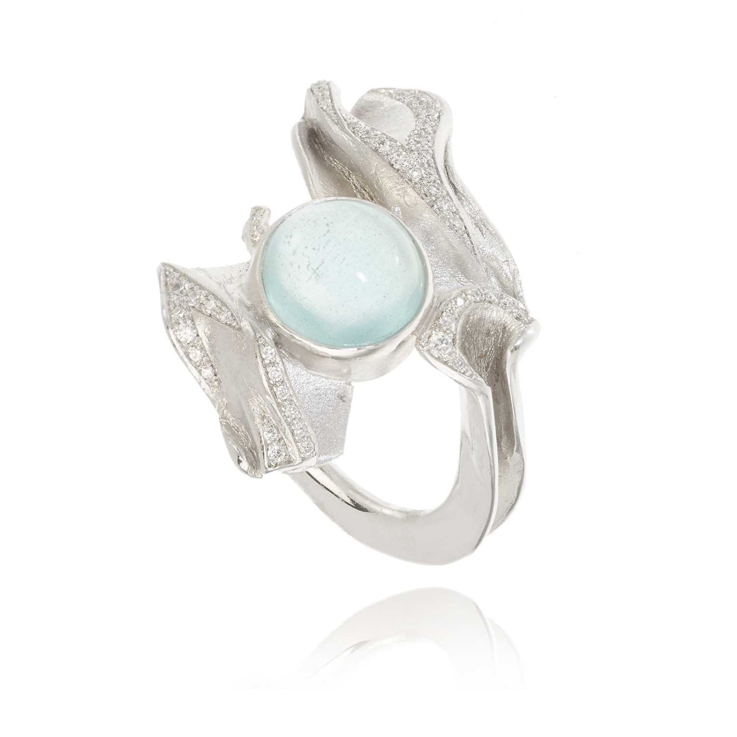 Lot 258 - Ken Bolan and Marinette Domon: a white gold diamond and aquamarine 'Touche de Soie' ring