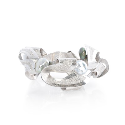 Lot 269 - Ken Bolan and Marinette Domon: a white gold, Tahitian pearl and diamond 'Baroque' bangle