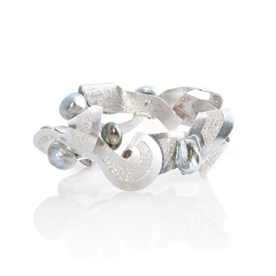 Lot 269 - Ken Bolan and Marinette Domon: a white gold, Tahitian pearl and diamond 'Baroque' bangle