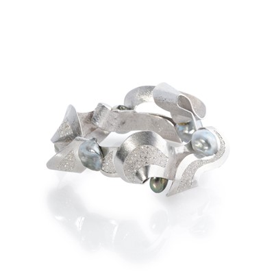 Lot 269 - Ken Bolan and Marinette Domon: a white gold, Tahitian pearl and diamond 'Baroque' bangle