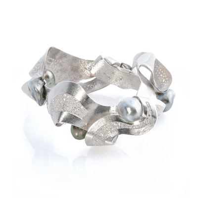 Lot 269 - Ken Bolan and Marinette Domon: a white gold, Tahitian pearl and diamond 'Baroque' bangle