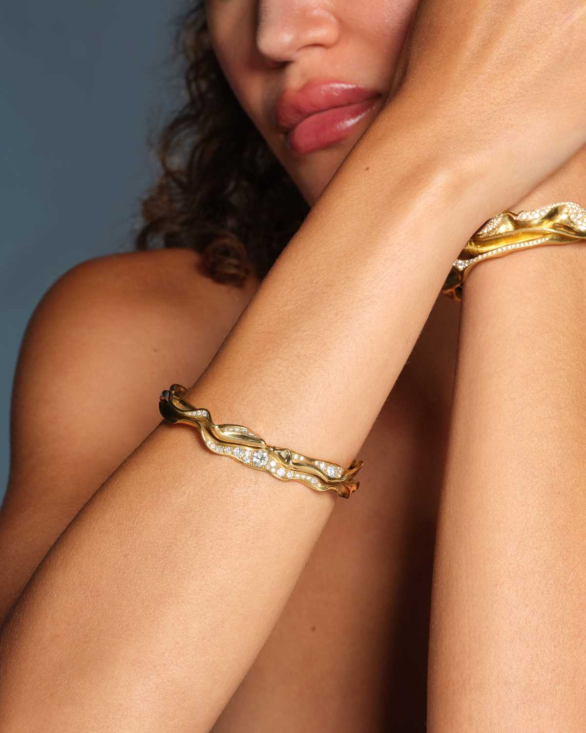 Lot 259 - Ken Bolan and Marinette Domon: a diamond 'Touche de Soie' cuff bangle
