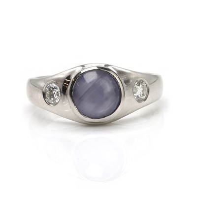 Lot 144 - A platinum, star sapphire and diamond ring