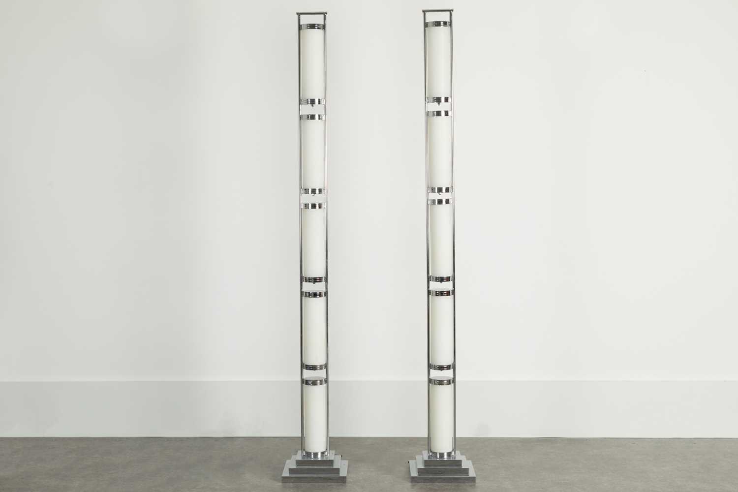 Lot 39 - A pair of chrome and acrylic floor-standing lights