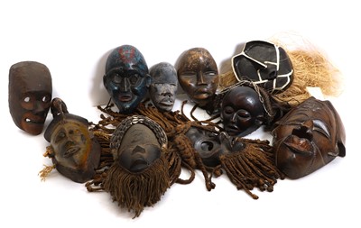 Lot 170 - A collection of Indonesian wooden masks