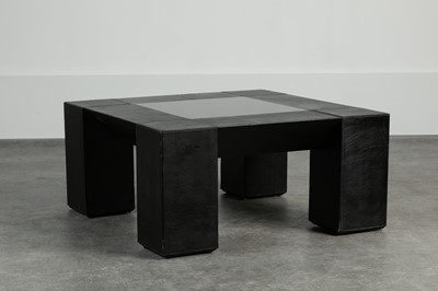 Lot 233 - A stitched leather-mounted coffee table