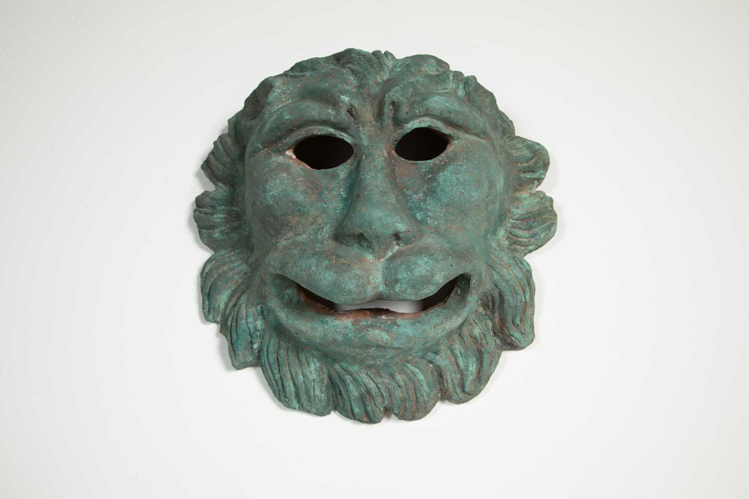 Lot 301 - A painted terracotta lion mask