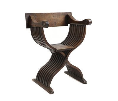 Lot 410 - A Northern European fruitwood X frame chair