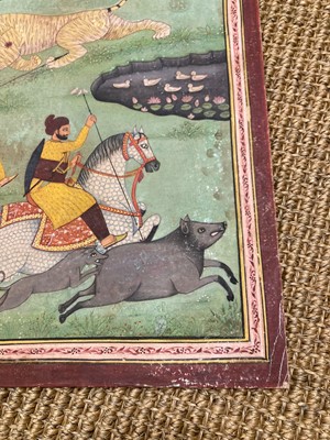 Lot 191 - A large Indian painting of a maharaja on a tiger hunt