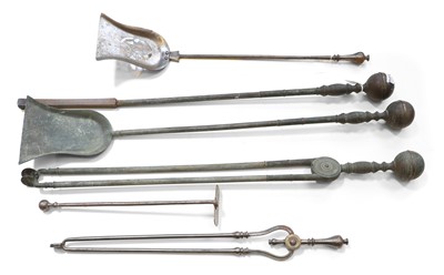 Lot 335 - A set of large brass fire irons