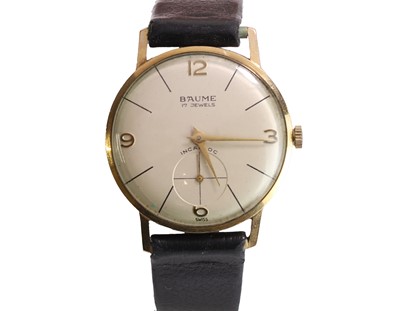 Lot 565 - A 9ct gold Baume mechanical strap watch