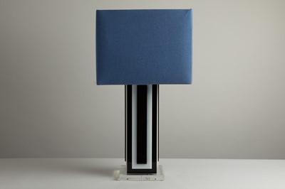 Lot 335 - A large black and white acrylic table lamp