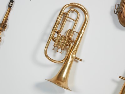Lot 46 - Five brass and silvered musical instruments