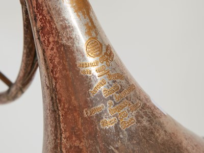 Lot 45 - Six brass and silvered musical instruments