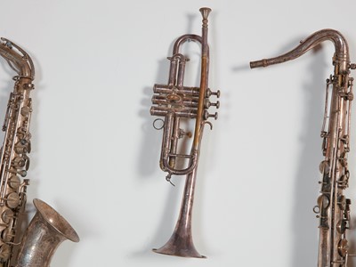 Lot 45 - Six brass and silvered musical instruments
