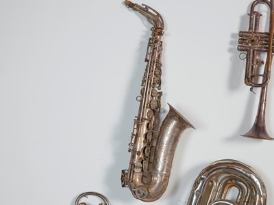 Lot 45 - Six brass and silvered musical instruments