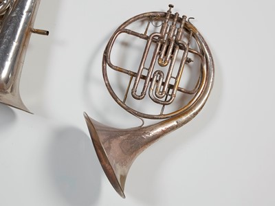 Lot 45 - Six brass and silvered musical instruments