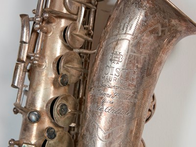 Lot 45 - Six brass and silvered musical instruments