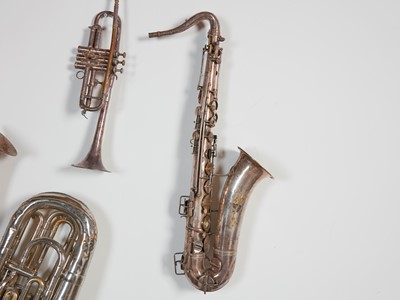 Lot 45 - Six brass and silvered musical instruments