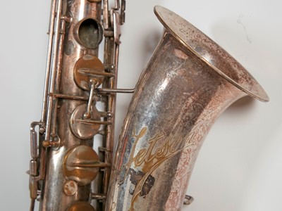 Lot 45 - Six brass and silvered musical instruments