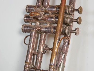 Lot 45 - Six brass and silvered musical instruments