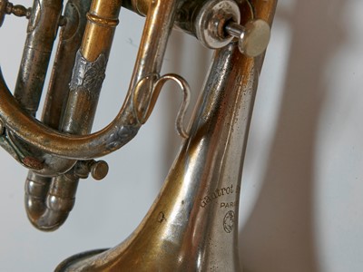 Lot 45 - Six brass and silvered musical instruments