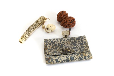 Lot 130 - A pair of Chinese carved nuts