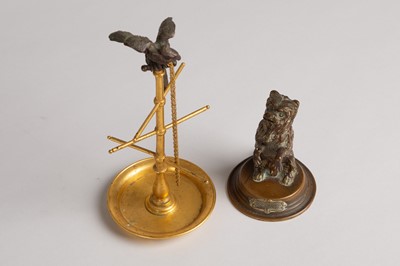 Lot 48 - A bronze and brass ring stand