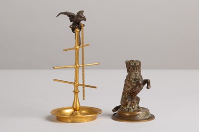 Lot 48 - A bronze and brass ring stand