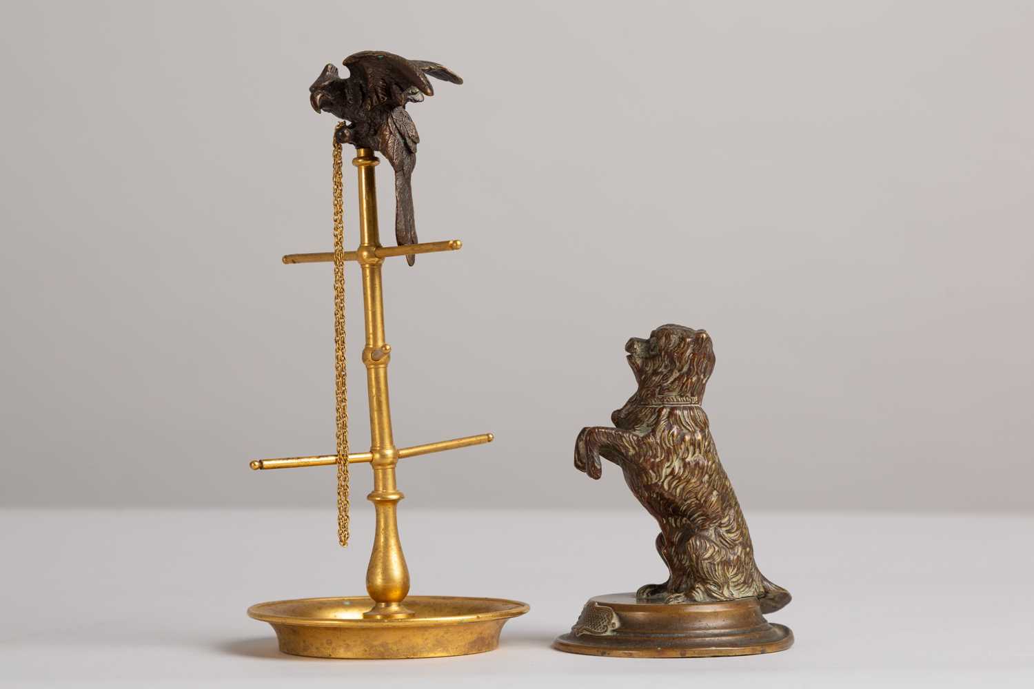 Lot 48 - A bronze and brass ring stand