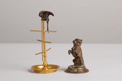 Lot 48 - A bronze and brass ring stand