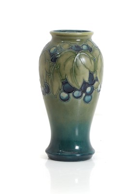 Lot 246 - A Moorcroft grape and leaf pattern baluster vase