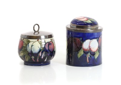 Lot 253 - A Moorcroft 'Wisteria' pattern pepper pot