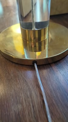 Lot 172 - A Lucite and brass-mounted table lamp