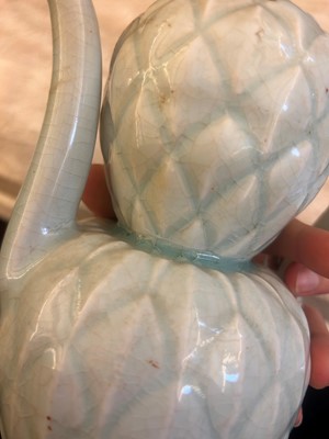 Lot 57 - A Chinese Qingbai ware ewer and cover