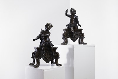 Lot 533 - A pair of patinated bronze chenet