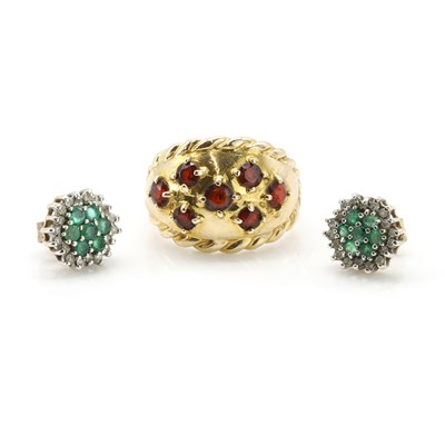 Lot 303 - A 9ct gold garnet set ring and a pair of 9ct gold emerald and diamond earrings