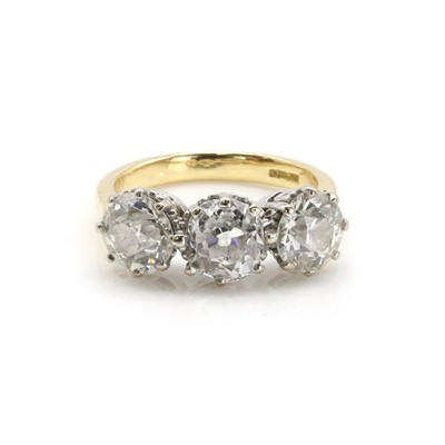 Lot 212 - An 18ct gold diamond three stone ring