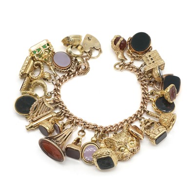 Lot 259 - A 9ct gold charm bracelet
