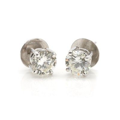 Lot 216 - A pair of 18ct white gold diamond stud earrings