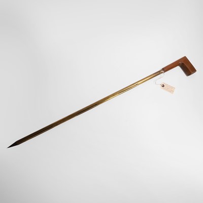 Lot 446 - A rare brass and wood farmer's corn drying walking stick